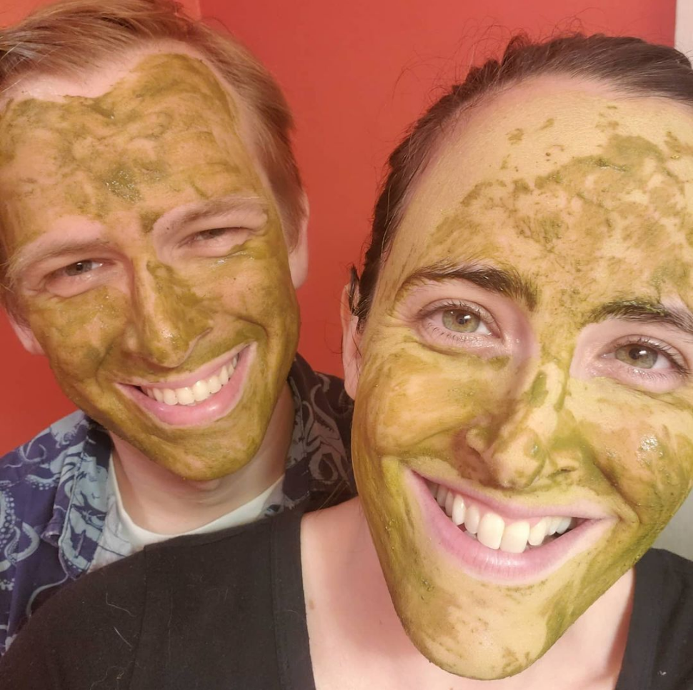 Laura and her partner, Andrew, with their homemade mud masks